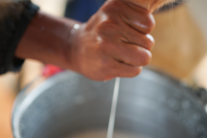 a close up of a person holding a pot