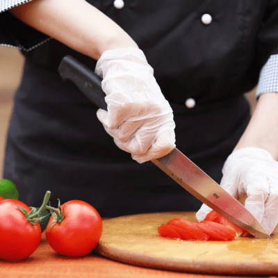 a person cutting a piece of food