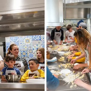 People of various ages cooking together in a kitchen with colorful tiled walls.