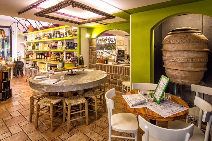 Ancient olive oil tools and presses displayed in an Italian olive oil museum