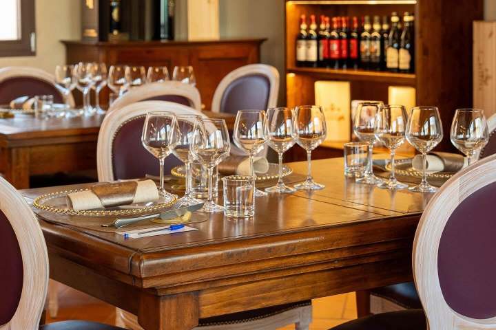 Bottles of Vernaccia DOCG and Super Tuscan wines lined up for a tasting