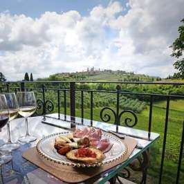 Tuscan wine tasting spread with cheeses, salami, and bruschetta in San Gimignano