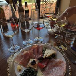 Tuscan wine tasting spread with cheeses, salami, and bruschetta in San Gimignano
