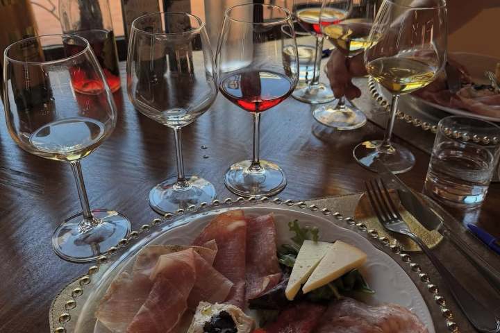 Tuscan wine tasting spread with cheeses, salami, and bruschetta in San Gimignano