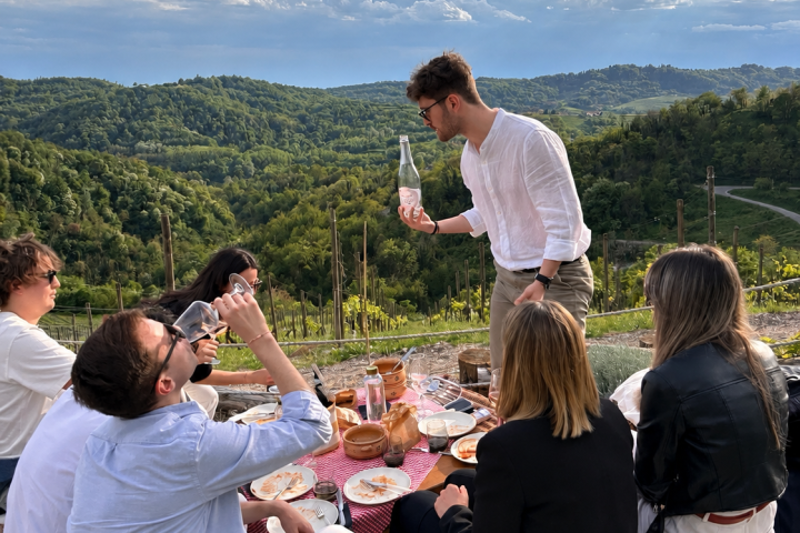 Golden hour view over Monferrato vineyards during wine picnic
