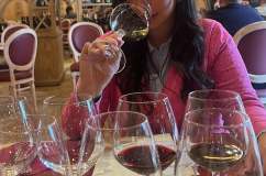 Golden Vin Santo wine poured into a glass in San Gimignano