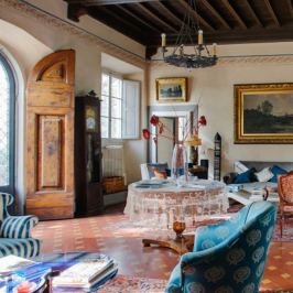 Historic villa living room with wooden beams and antique furniture in Chianti, Tuscany