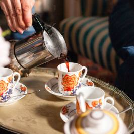 Coffee poured into vintage cups on a tray in a Tuscan villa near Florence